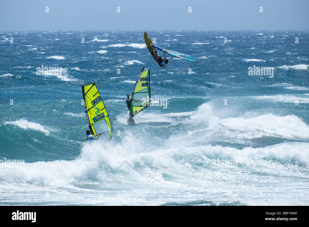 Pozo Izquierdo, Gran Canaria, Canary Islands, Spain. 5th July 2025. Huge jumps in sreaming 50 knot winds as the world`s best wave sailors compete at the PWA (Professional Windsurfers Association) world wave sailing championship tour at Pozo on Gran Canaria. Pozo is famed, and feared by many, for its howling 50 knot summer winds. Credit:Alan Dawson/Alamy Live News. Stock Photo